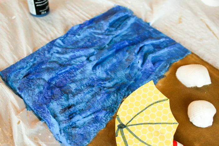 Allow students to paint their Rigid Wrap oceans in a variety of blue tones to add to the dimension in the artwork.
